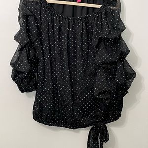 Black off-shoulder tie-waist blouse with small white polka dots.